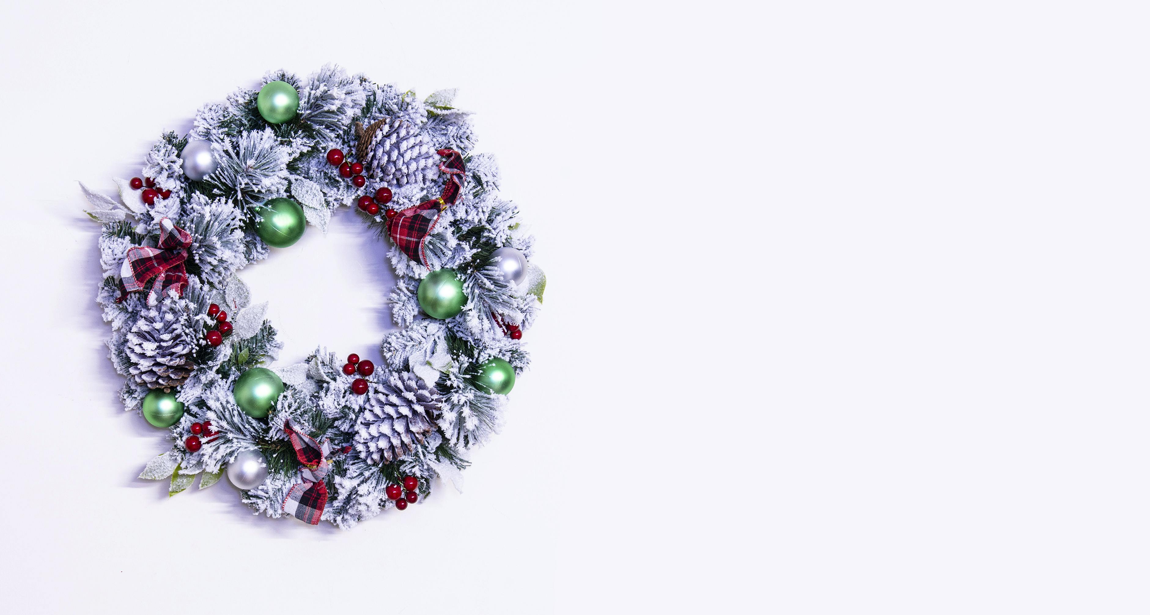 50cm Flocked Decorated Mixed Pine Wreath with Tartan Bows