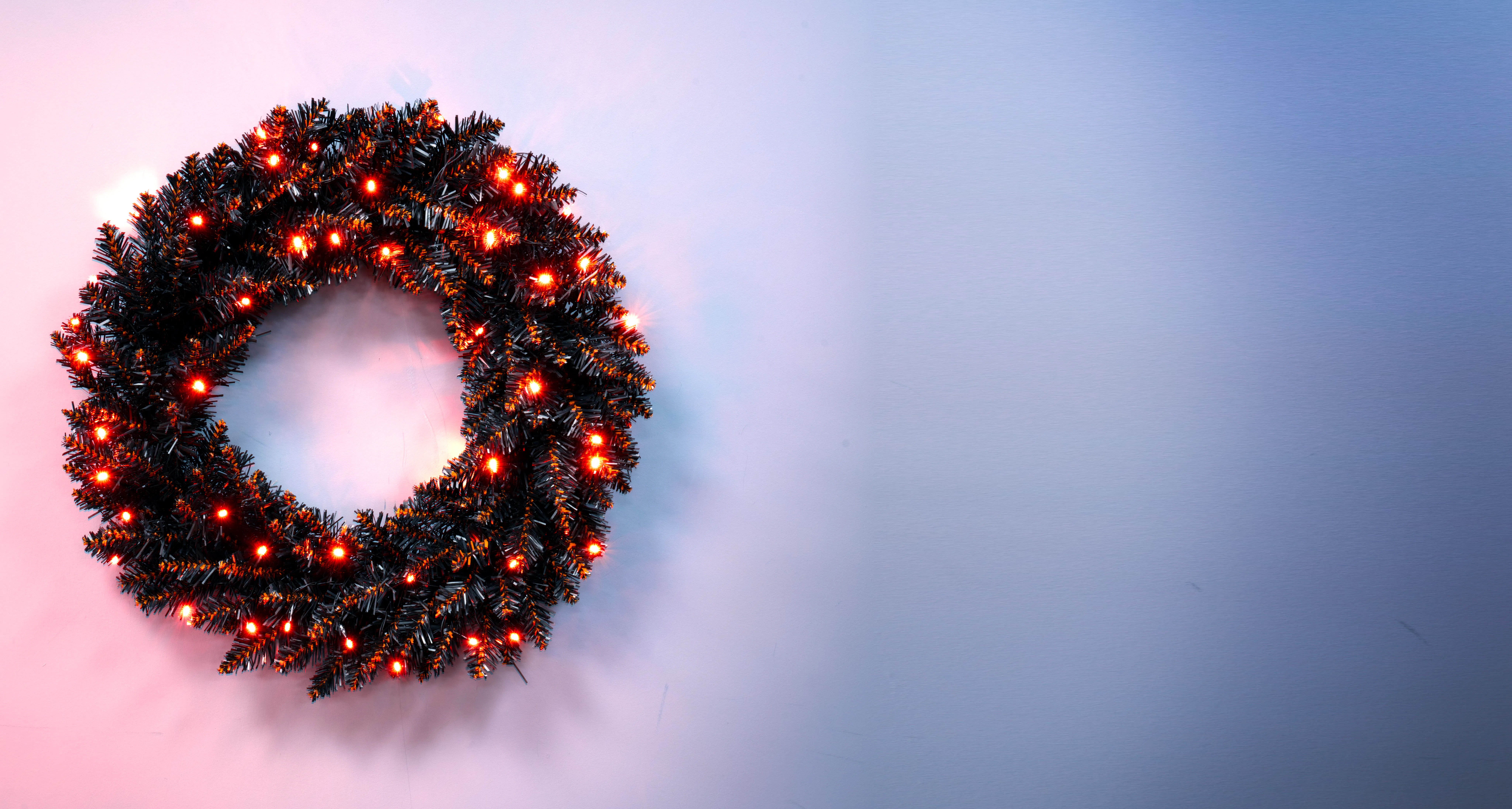 The 60cm Pre-lit Hallowshade Fir Wreath - Orange Lights